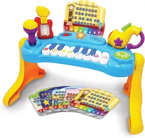 Little Virtuoso Baby Music Center with Stand Including an 8 Note Piano, Song Sheets, 2 Play Modes, Microphone, Guitar, Trumpet & Trumpet Sounds.